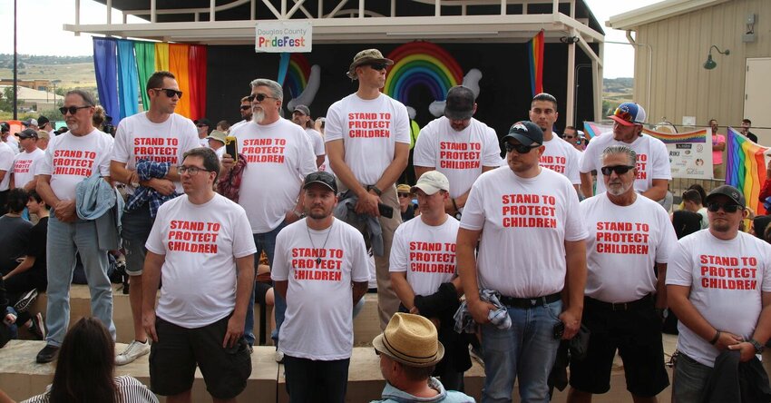Members of Able Shepherd stand in front of the stage at Castle Rock PrideFest on Aug. 26 to block the "G-rated" drag show. After negotiations with event security, protesters eventually moved so that the stage was visible and the show could continue.